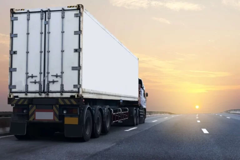 white-truck-on-highway-road-with-container-transport-on-the-asphalt-expressway-1024x683